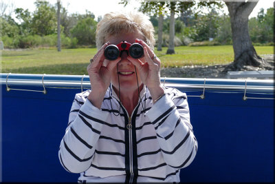 Looking At Photographer Through Binoculars