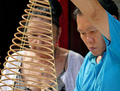 Preparing Incense Coils in Temple