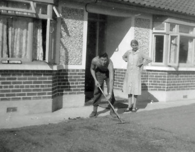 1947 Veronica supervising as Clem grades the yard
