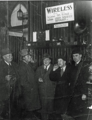 c 1923 Willie (far right) celebrates installation of wireless radio in his pub.