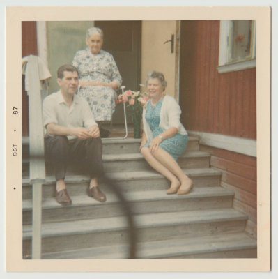 Hulda Lingblom (83 yr old) and son Birger and another woman on steps of Lingblom house, Lingbo