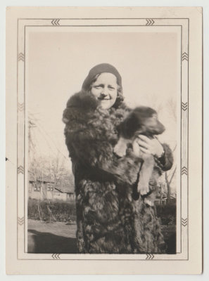Katherine Oberg Van Fleet holding puppy, 1930