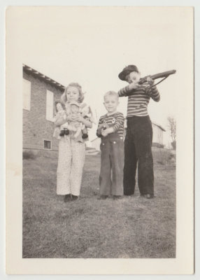 young Kay, Chuck, Bob Van Fleet with toys, Christmas 1943