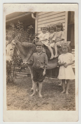 young Katherine Oberg and other kids on donkey