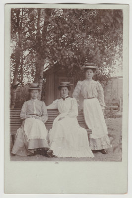 Three young women with hats, unknown