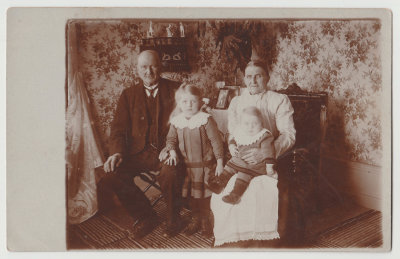 older man, woman and two children 