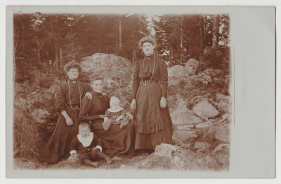 three unknown women and two children in wood, formal dress