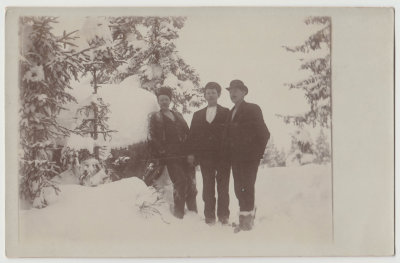 Three young men in snow