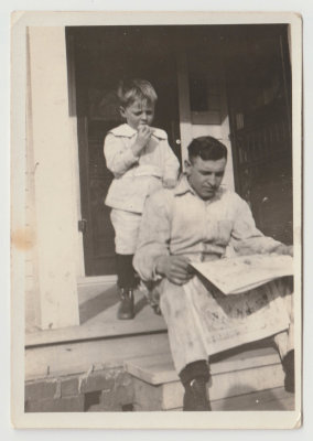 Dave and John Olof Oberg reading newspaper
