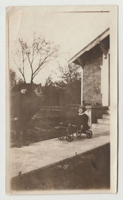 Two kids, one in wagon