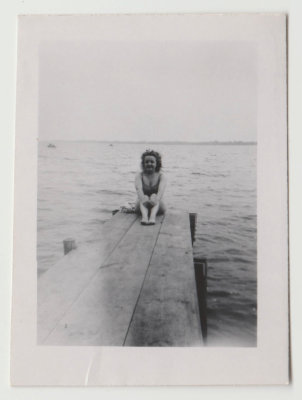 Helen Oberg in swimsuit on dock