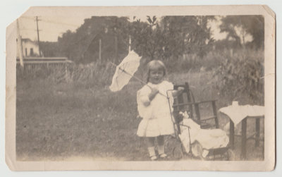 Katherine Oberg with doll and parasol