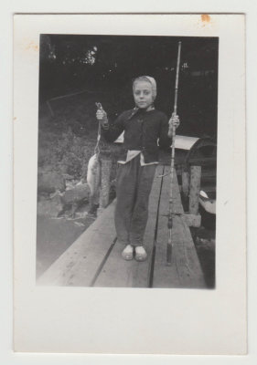 young Kay Van Fleet with fish