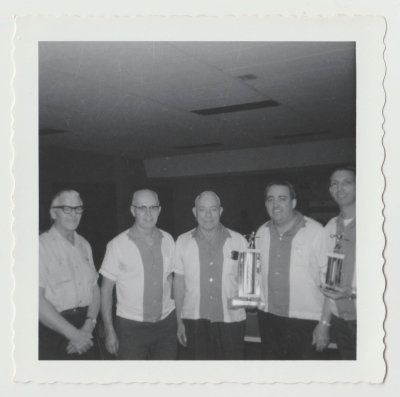 Harold Van Fleet with bowling team and trophy