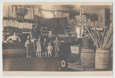 Harold Van Fleet's father, William Lawrence Van Fleet, Notation on back of photo postcard states the picture was taken at Company Store in Hynes, IA; with Dad Van Fleet on left.