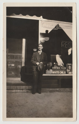 Raymond Cox in front of wife Alta's store