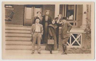 Beba and group posing on steps