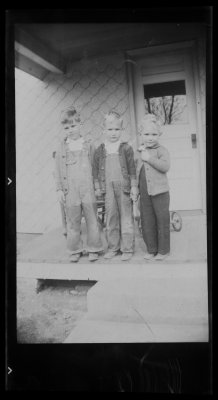 Richard, Leonard and John Veak on porch
