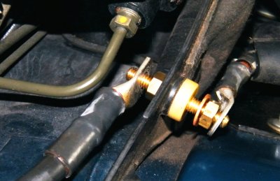 Make sure all surfaces are clean and smear with di-electric grease. Always use two wrenches to tighten
