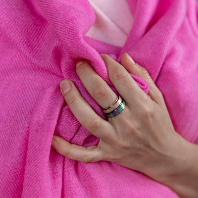 Woman-hand-pink-shawl-spinning-rings-Australia-gold-rainbow.jpg