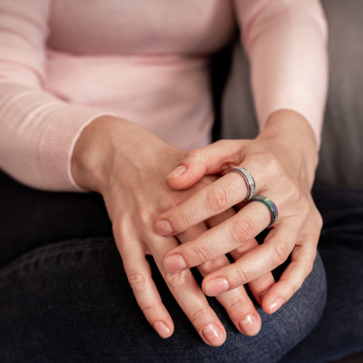 Woman-pink-jumper-spinning-rings-Australia-silver-rainbow.jpg
