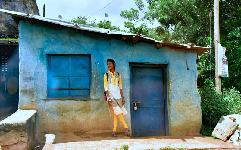 School girl and blue house - India 1 9050