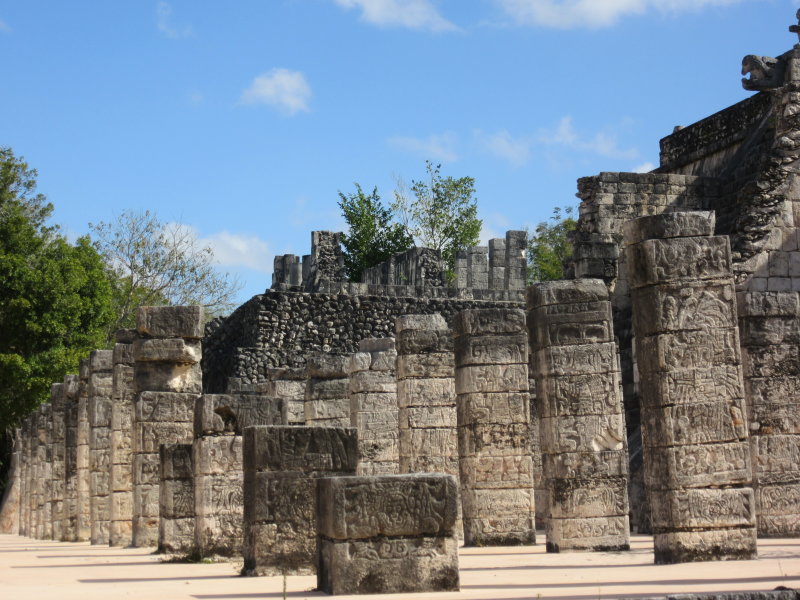 Many columns are carved with figures of warriors