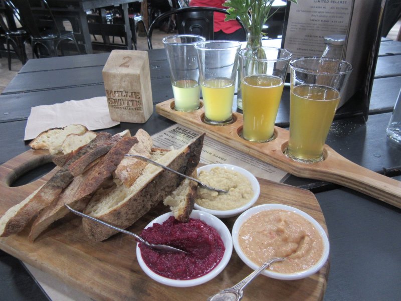 A cider tasting paddle and some sourdough bread and dips - delish