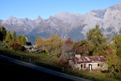 Sun rising over old shed, Haute-Nendaz