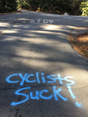 Graffiti on Kings Mountain Road which is between Woodside and highway 35 and unicycles descending - such skill