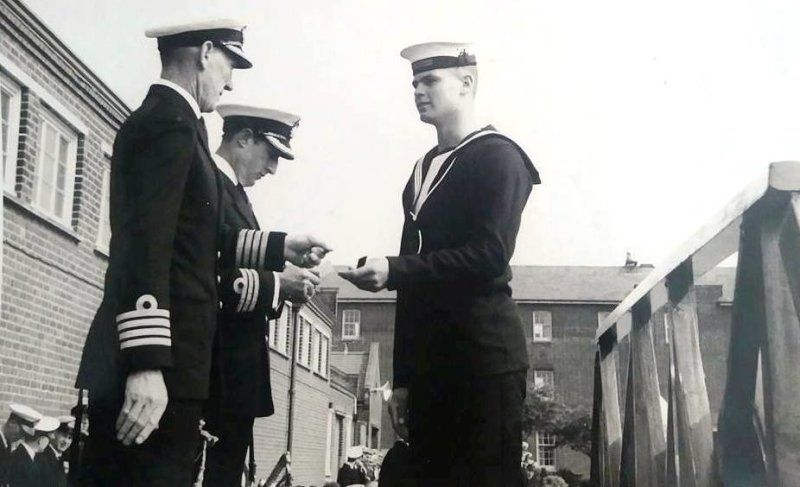 1957, JANUARY - BOB HOOKWAY, RECEIVING RUGBY COLOURS FROM CAPT. RD FRANKS, WITH CDR. McCRUM..jpg