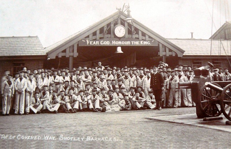 UNDATED - GROUP PHOTO OF BOYS IN DUCK SUITS AT TOP OF LONG COVERED WAY.jpg