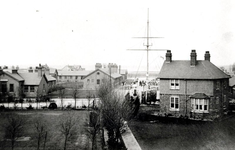 1910 - SHOWING THE ADMIN BLOCK ON THE LEFT WITH DIVISIONS ON THE QUARTER DECK..jpg