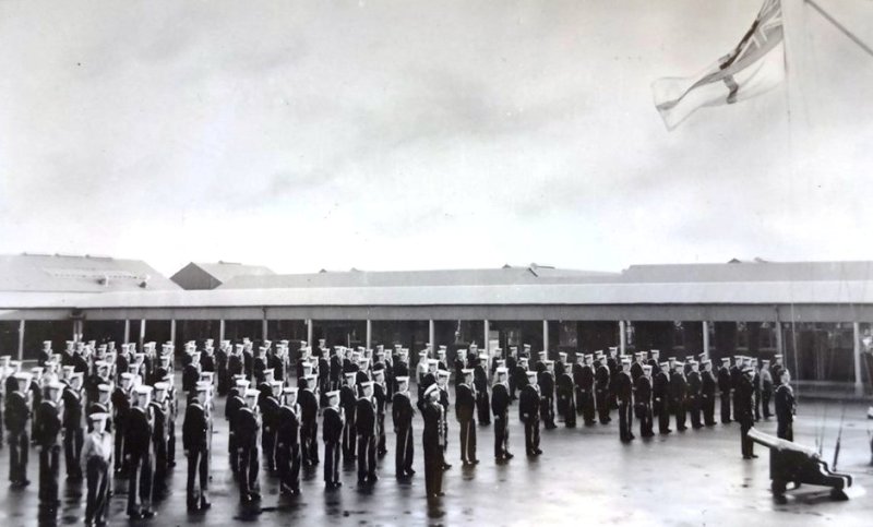 1950S - IAN GILLARD, ANNEXE, DIVISIONS, PROBABLY DURING THE WEEK AS PERSON HOISTING ENSIGN IS NOT WEARING A CAP 