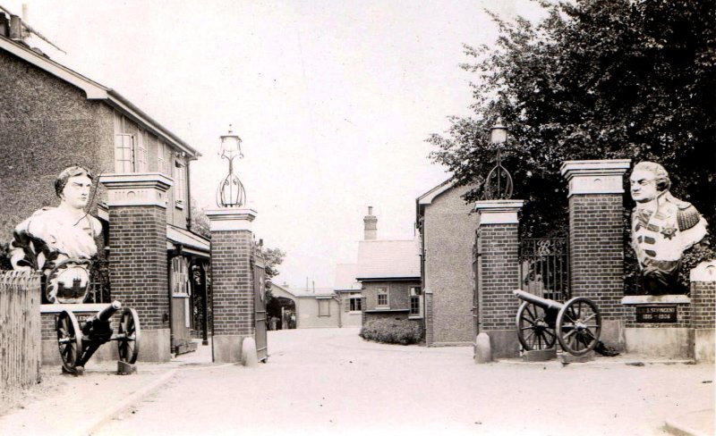 1937- PHILIP ANTHONY (TONY) FOSTER POST CARD SHOWING MAIN GATE AND GUARDHOUSE.jpg