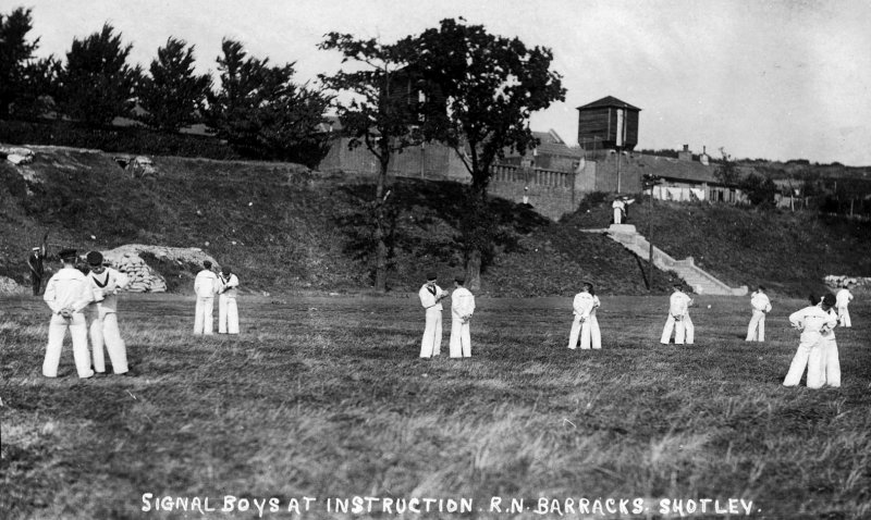 UNDATED - SIGNAL BOYS UNDER INSTRUCTION ON THE LOWER PLAYING FIELD, SEMAPHORE EXERCISE.jpg