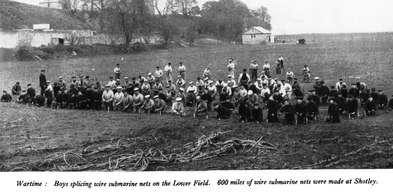 1914-18 - BOYS SPLICING WIRE SUBMARINE NETS ON THE PLAYING FIELD, SOURCE SHOTLEY MAGAZINE.
