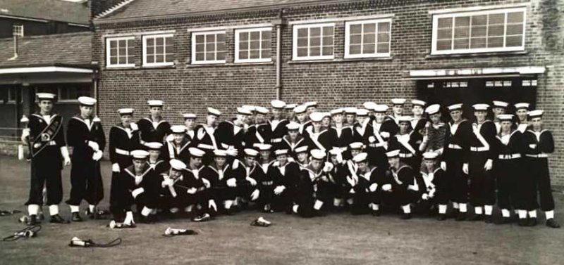 1970, SUMMER - RAY STANDLEY, THE BUGLE BAND WAITING TO PASS THROUGH NELSON ON TO THE PARADE GROUND FOR PARENTS DAY.jpg