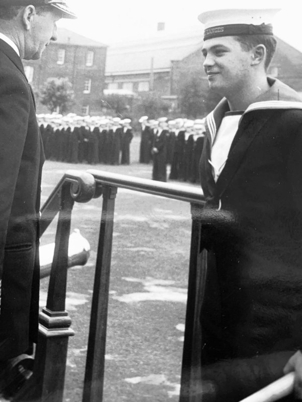 1961, 6TH FEBRUARY - ALEC TARASIUK, J.N.A.M.2., RECEIVING SOFTBALL PRIZE FROM CAPT. GOWER IN THE SUMMER.jpg