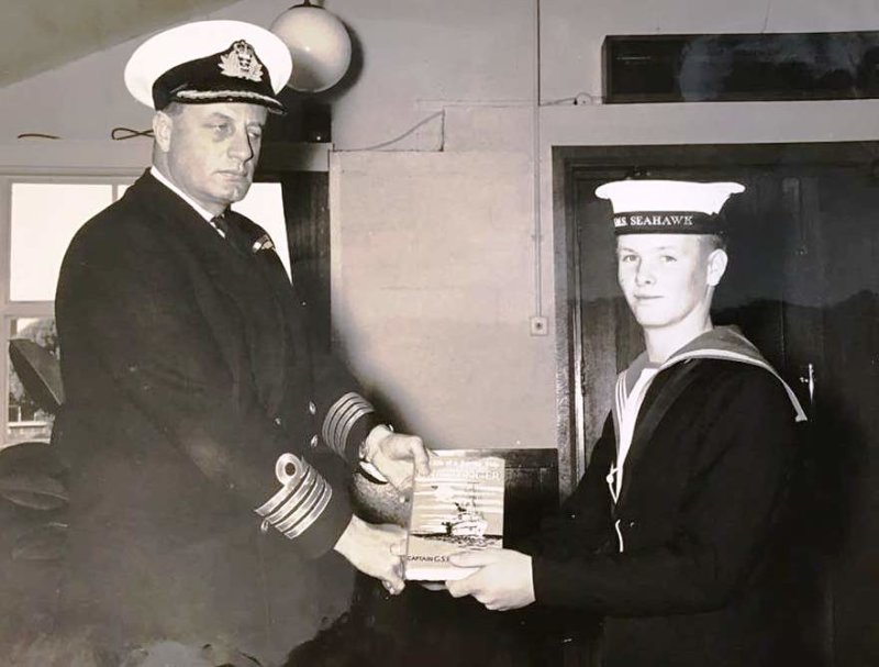 1964, SEPTEMBER - PHILLIP JOHN GILLETT, 71 RECR., RECEIVING MATHS PRIZE FROM CAPT. OF RNAS CULDROSE.jpg