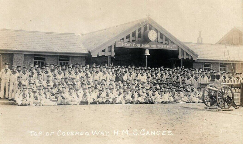 UNDATED - LARGE GROUP OF BOYS IN DUCK SUITS AT TOP OF LONG COVERED WAY.jpg