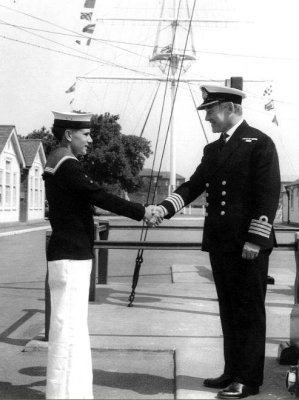 1970 - ADRIAN KING, PARENTS DAY BUTTON BOY, RECEIVING HIS CROWN PIECE FROM CAPT. BUTTON.jpg