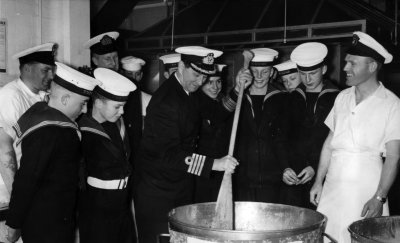 1961, 1ST MARCH - ROY LUCK, MIXING THE CHRISTMAS PUDDING, WITH CAPTAIN GOWER..jpg