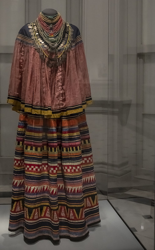 Womans patchwork cape, skirt, and stacking necklaces, Seminole artists, c. 1920