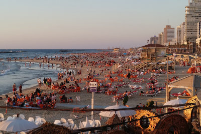 Beachgoers enjoying the sunset, Tel Aviv