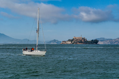 A sailboat on the bay, with Alcatraz in the background