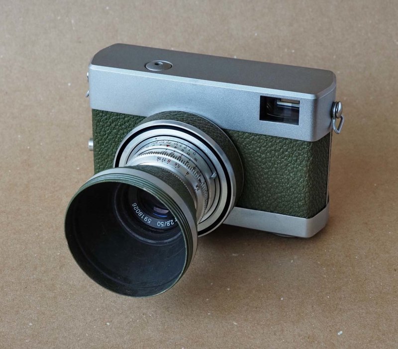 This Olive Green Werra with its hood; this camera has a very clean design; speeds from 1 to 1/250 sec.