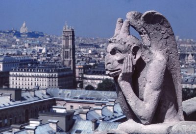 The gargoyles; in the background, the Tour Saint Jacques and, farther, the Sacré Coeur. 
