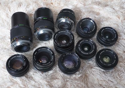 My Olympus Zuiko lens Collection: 21/3.5, 24/2, 28/2.8, 35/2, 40/2, 50/1.4, 50/1.8, 55/3.5 macro, 100/2.8, 135/2.8 and 200/5. 