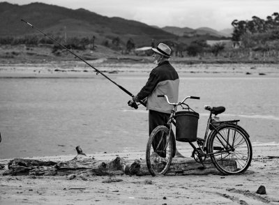 Fisher at the mouth of the Rio Tijucas.